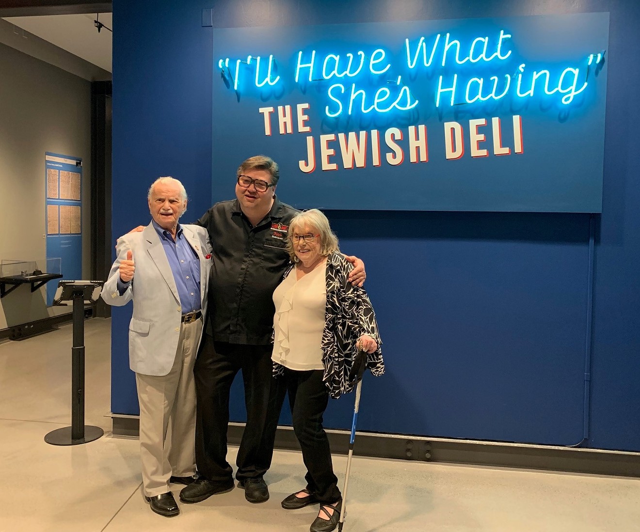 Bill Orlin, Ziggy Gruber and Ruth Steinfeld pose in front of the new exhibit.