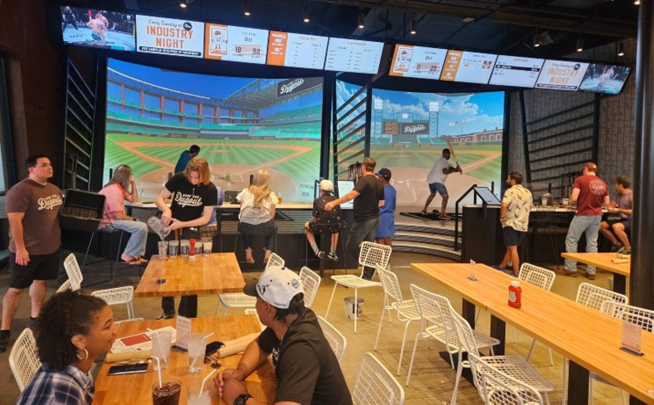 Sports fans swing for the fences in Home Run Dugout's batting bays