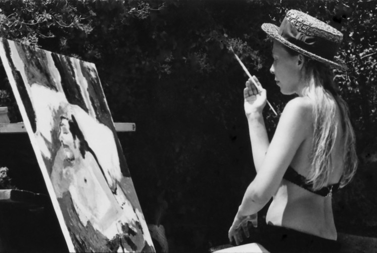 "Joni Painting Outside," 1969, Laurel Canyon. She is painting a portrait of Nash, which he still has.