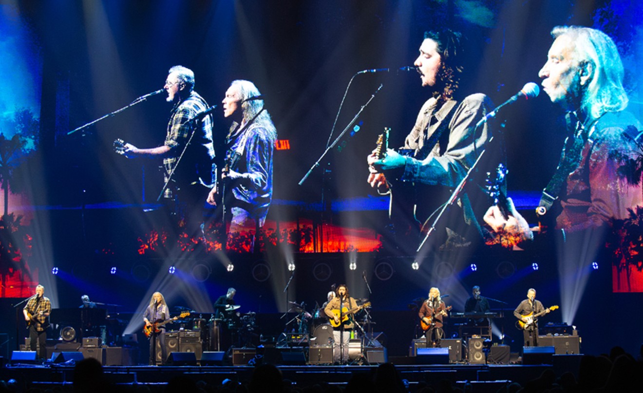 The Eagles front line: Vince Gill, Timothy B. Schmit, Deacon Frey, Joe Walsh and Stueart Smith (Don Henley is on drums at back).
