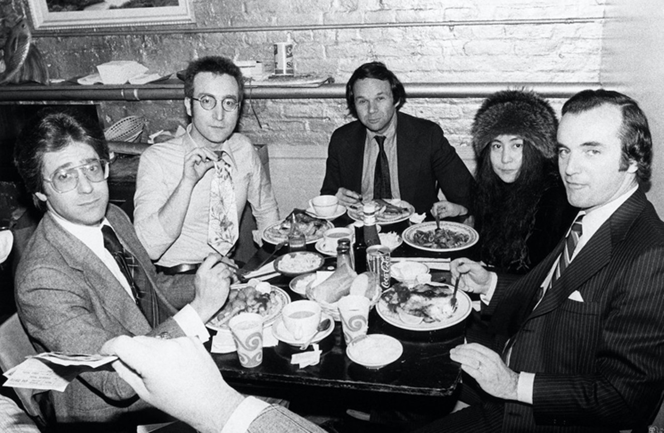 John Lennon and Yoko with legal team (Jay Bergen at far right) at Sloppy Louie’s in New York, 1975.