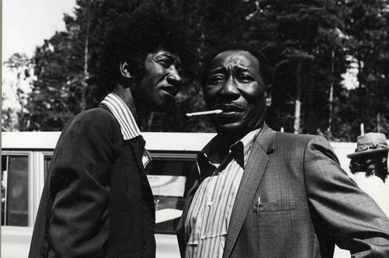 Hound Dog Taylor (left, in afro wig) with Muddy Waters at the 1972 Ann Arbor Blues & Jazz Festival.