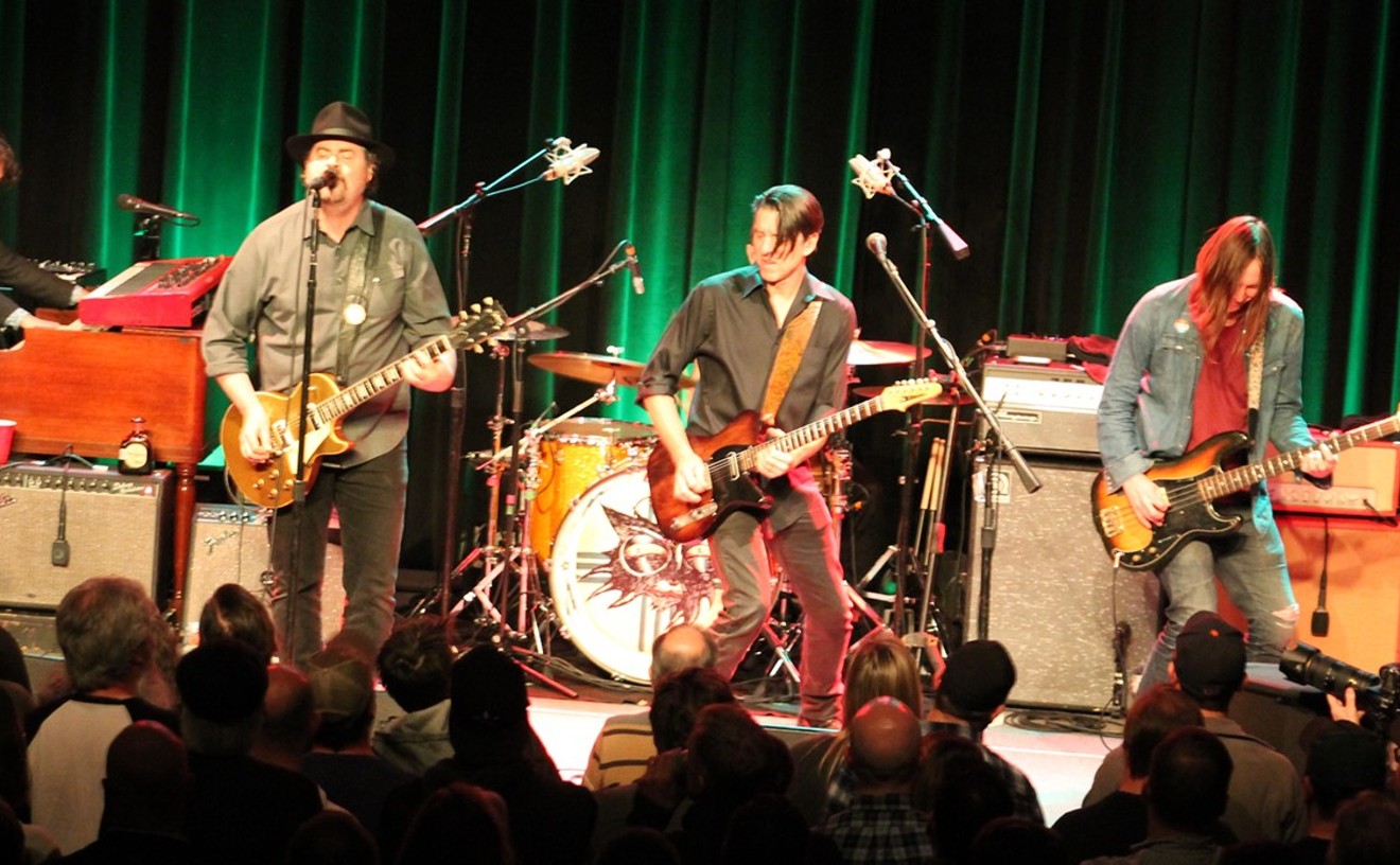 The Drive-By Truckers during their last Houston appearance in November 2019: Jay Gonzalez, Patterson Hood, Mike Cooley, and Matt Patton. Drummer Brad Morgan is hidden.