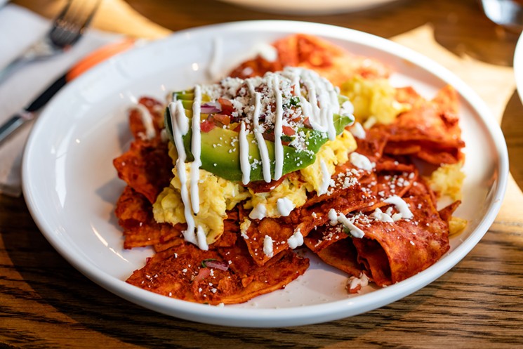 Chilaquiles and build-your-own mimosas from FM Kitchen are one way to extend the summer. - PHOTO BY KIRSTEN GILLIAM