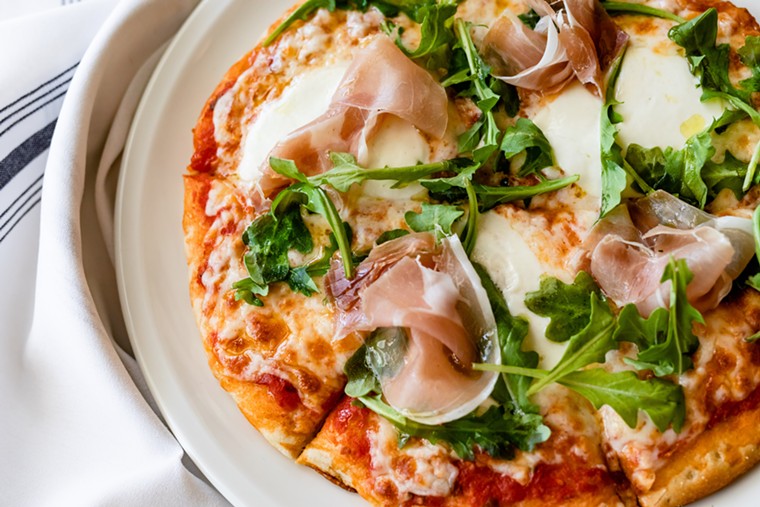 The Prosciutto and Arugula pizza at Lulu's exemplifies Italian cuisine. - PHOTO BY KIRSTEN GILLIAM