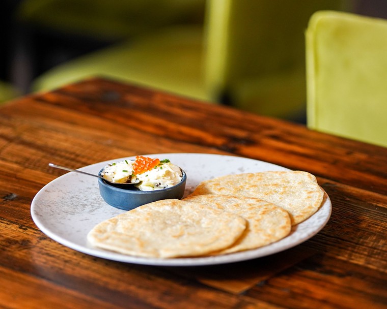 Homemade flour tortillas get a sexy kiss of salmon roe and truffle butter. - PHOTO BY DYLAN MCEWAN