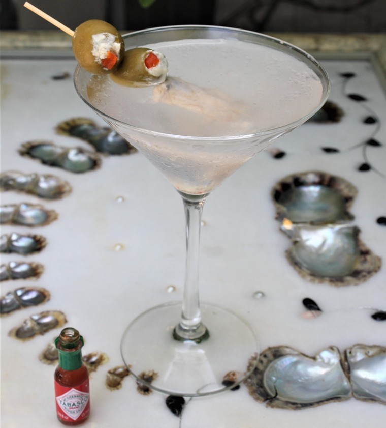Ousie's plops a cold oyster in a special martini. - PHOTO BY ADAM DINARI