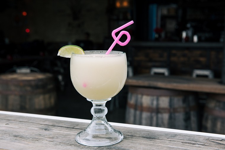 Hit Eight Row flint for margaritas kissed with hibiscus serrano syrup, crème de cacao and more. - PHOTO BY MIKAH DANAE