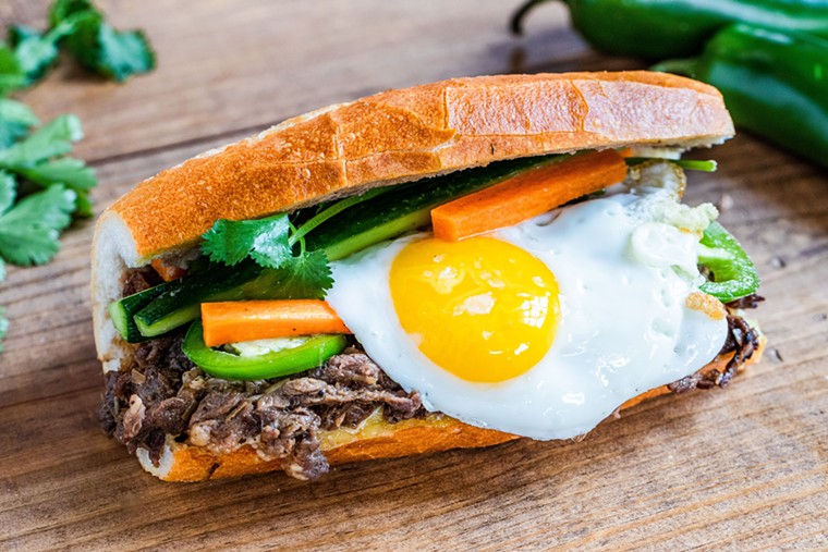 The rib eye banh mi can be upgraded with a fried egg on top. - PHOTO BY BECCA WRIGHT