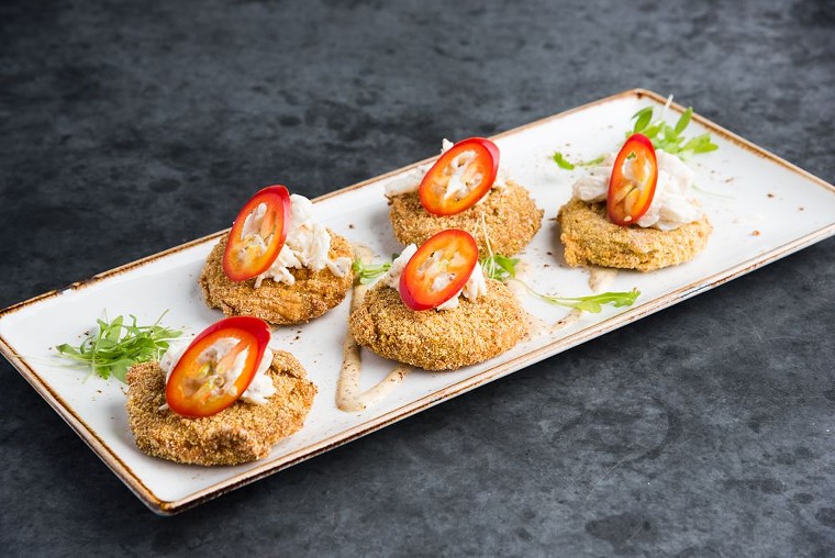 Humble fried green tomatoes get an upgrade with the addition of lump crab meat. - PHOTO BY STATE FARE KITCHEN & BAR
