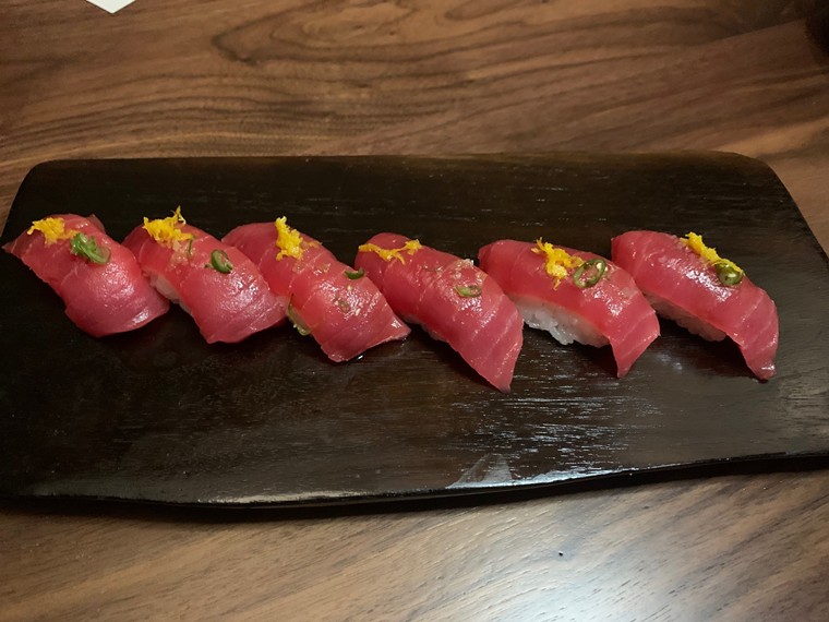 The bluefin tuna nigiri is topped with chili and orange zest. - PHOTO BY LORRETTA RUGGIERO